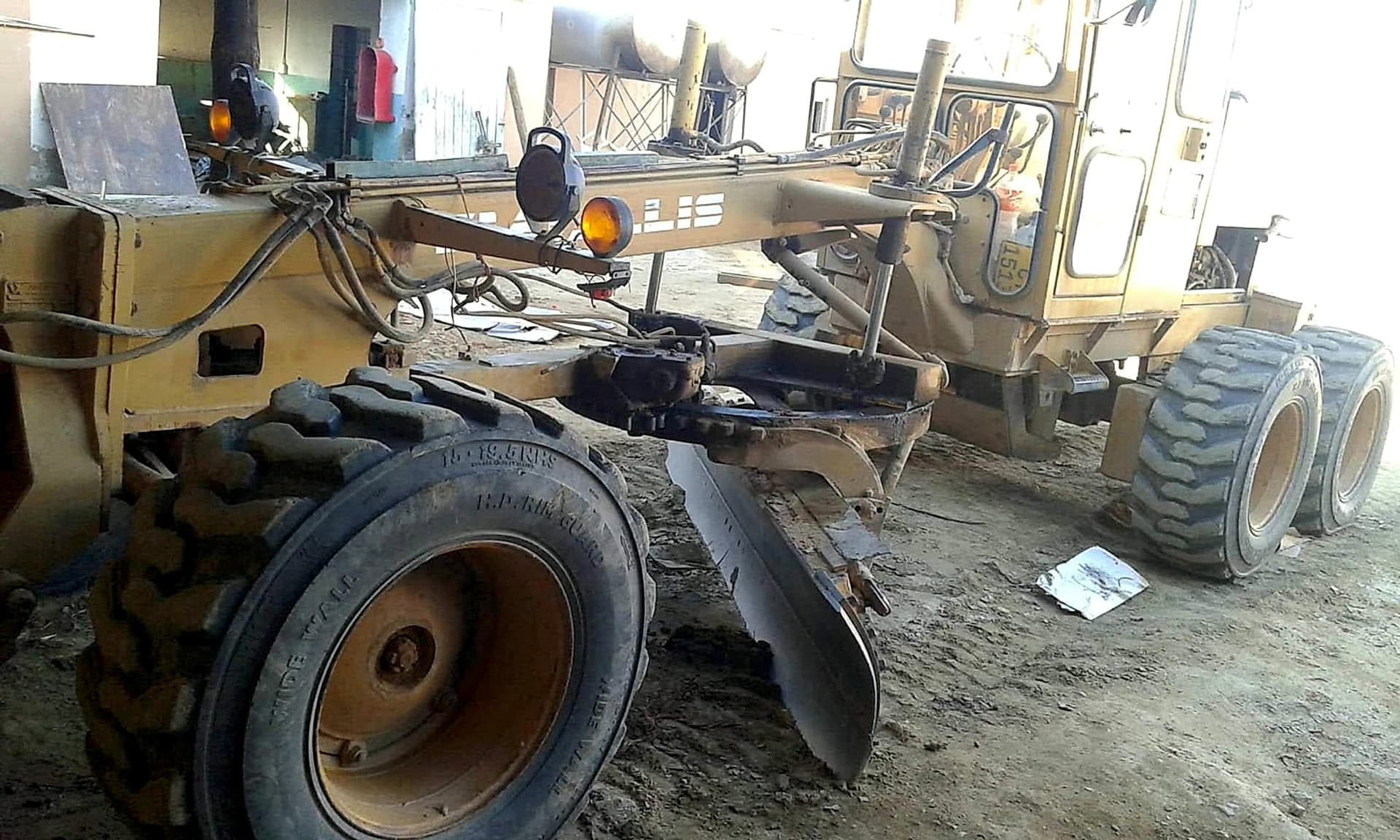 Heavy machinery being serviced in the Bang Metal Fabric workshop